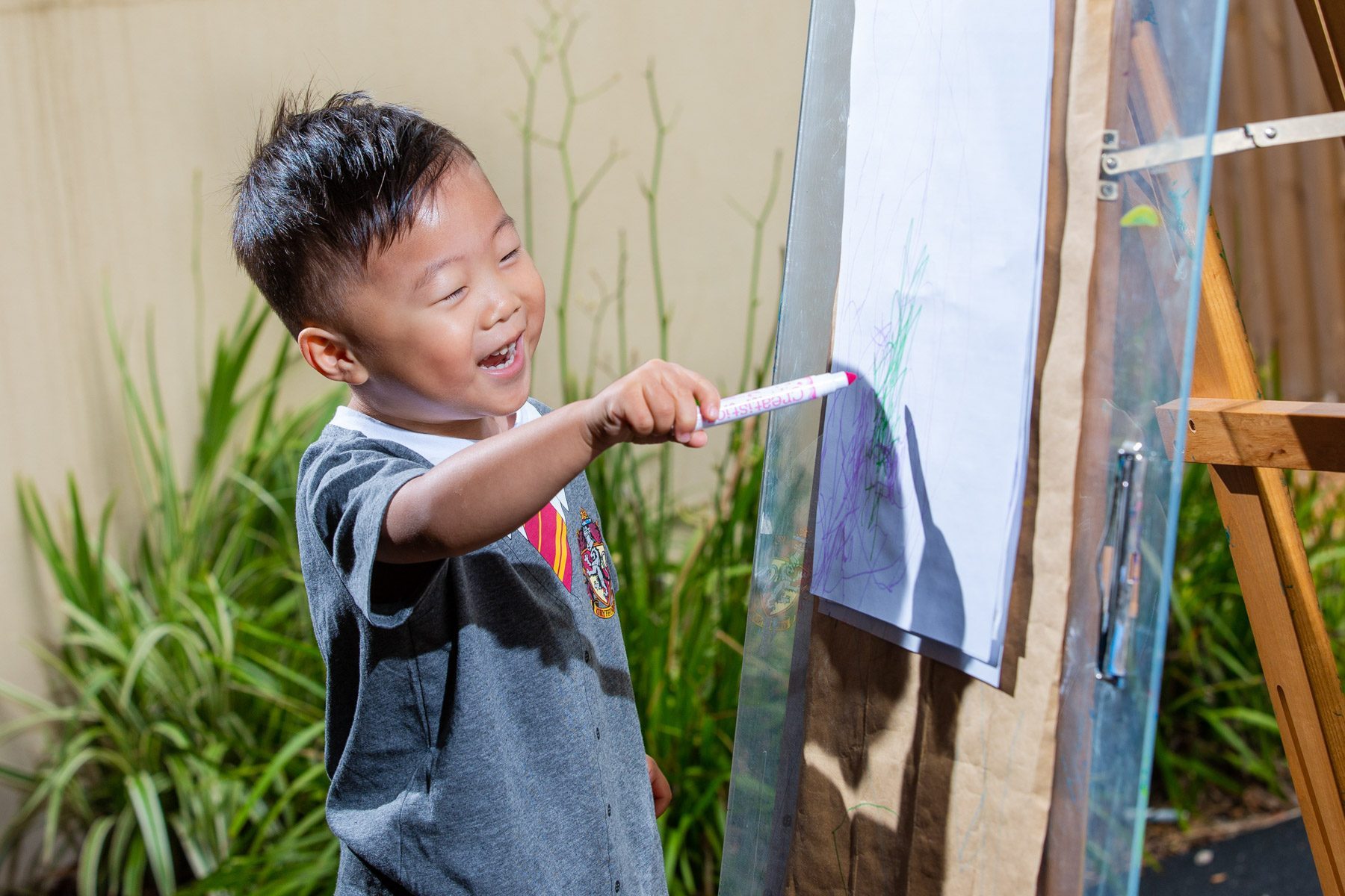 A child painting at an easel
