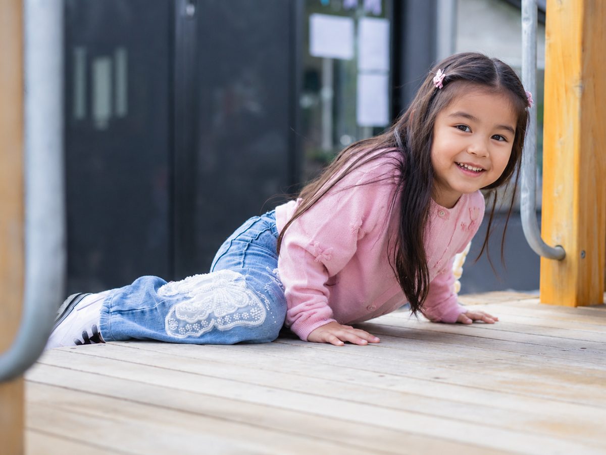 A child running through a sunny playground