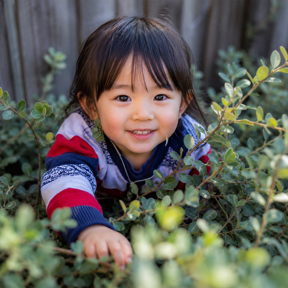 A child exploring the garden outdoors